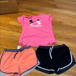 2 under armour shorts and 1 under armour shirt